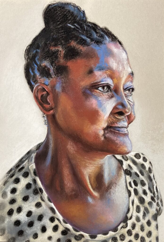 Woman in polka dot dress by Anna Stone - Soft powder pastel and charcoal on toned Fabriano paper